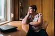 © Santi Nuñez/Stocksy - Joyful portrait of a mentally challenged woman smiling in her room