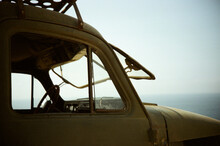 Vintage Car Facing The Sea With Windshield Open
