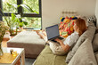 © Boris Jovanovic/Stocksy - Workday from a cozy living room