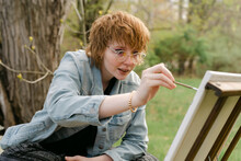 Young Artist Painting On Canvas
