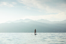 Woman On SUP Paddle Board 