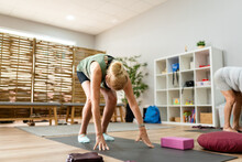 Older Woman In Pilates Class.