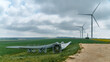 © Adam Sébire/Stocksy - Renewable energy wind turbine blade parts await repair and replacement