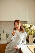 Portrait Of A Lovely Woman With A Cup Of Coffee