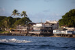 A view of historic Front Street stores and restaurants in the whaling town of Lahaina Maui Hawaii as seen from the harbor.  