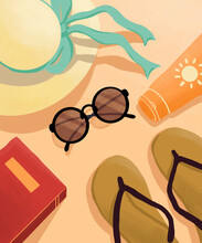 A Peaceful Beach Scene, Featuring A Sun Hat, Sunglasses