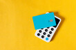 © Shava Cueva/Stocksy - Wireless payment with a blue credit card on a terminal