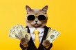 Leinwandbild Motiv Cool rich successful hipster cat with sunglasses and cash money. Yellow background