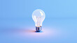 © alexxndr - light bulb on blue background