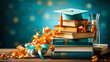 © sanjit536 - Graduation hat and book on reading desk On a blue background