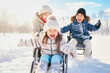 © the_lightwriter - kid in wheelchair playing in the snow