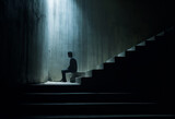 Fototapeta Miasto - silhouette of someone sitting in the dark