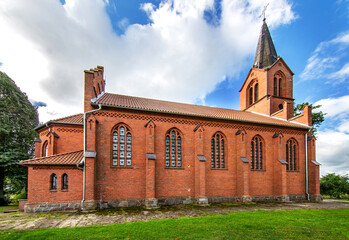 Wall Mural - General view and close-up architectural details of the Catholic Church of St. Holy Trinity in the town of Dwawrzuty in Masuria in Poland.