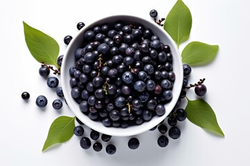 Overhead view of a white bowl overflowing with vibrant acai berries and leaves set against a clean white background. Generative AI