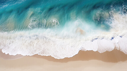 Overhead photo of crashing waves on the shoreline beach. Tropical beach surf. Abstract aerial ocean view