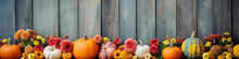 Colorful Autumn Bottom Border Banner Of Flowers And Pumpkins On Background Of A Rustic Wooden Siding With Copy Space. Generative AI.