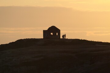 Canvas Print - Little house on the hill at sunset