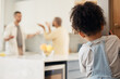 Lgbt, divorce and girl child watching gay parents argue in kitchen with stress, worry or fear in their home. Family, crisis and homosexual men dispute foster kid custody, affair or conflict in house