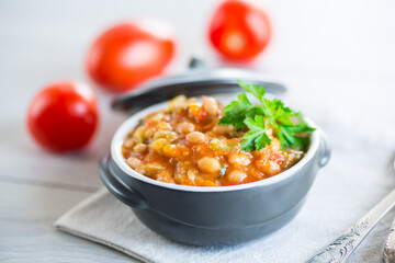 Wall Mural - Cooked white beans with zucchini and other vegetables.