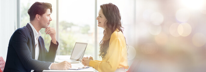 Business man and business woman discussing strategy business planning together on office desk in office. Double exposure and banner cover