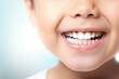 Child smile showing teeth close up. White teeth of a child isolated. Child dental health poster concept