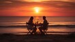 A couple sits at a table on the beach at sunset