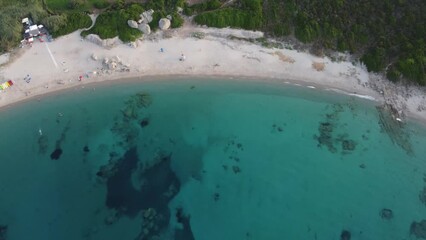 Poster - Drone shot over a blue shoreline with white sandy beach