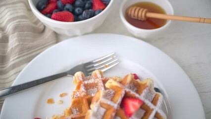 Sticker - half eaten belgium waffle with strawberry, blueberry and honey