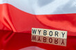 Elections in Poland year 2023, Concept, White and red national banner encouraging to go to vote in parliamentary elections. the word WYBORY in Polish meaning Elections in English.