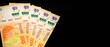 Banknotes of 1000 Argentine pesos, Argentine money, Argentine currency, Argentine pesos. Pile of several thousand Argentine peso bills, one thousand peso bills in cash on black background