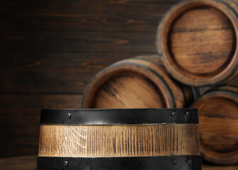 Canvas Print - Wooden barrels in cellar, selective focus. Space for text