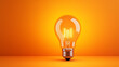 LED filament light bulb with copy space on orange background