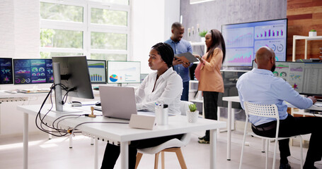 Poster - African Financial Data Analysts Using Dashboard On Screens