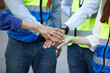 © offsuperphoto - group of workers join hands together for success work or project