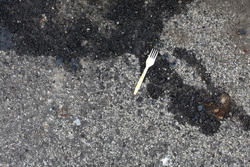 Wall Mural - Plastic fourch left on the pavement - seafront - Aberdeen - Scotland - UK