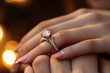 © Planetz - Close up of an elegant engagement diamond ring on woman finger. love and wedding concept.