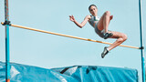 Fototapeta  - High jump, woman and fitness with exercise, sport and athlete in a competition outdoor. Jumping, workout and training for performance with action, energy and contest with female person and athletics