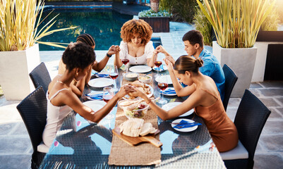 Wall Mural - Holding hands, food and people pray outdoor at table for gratitude and holiday celebration. Group of friends together at lunch, party or reunion with drinks in garden for thanks, prayer and grace