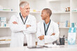 © Ilzer/peopleimages.com - Medical, smile and arms crossed for pharmacy with a team in a drugstore for healthcare or treatment. Medicine, collaboration or teamwork with a man and woman pharmacist happy a dispensary together