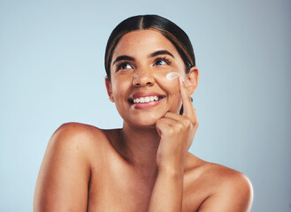 Face, cosmetics cream and portrait of woman with aesthetic shine, dermatology and skincare makeup on studio background. Happy model thinking of facial sunscreen lotion for self care, beauty and glow