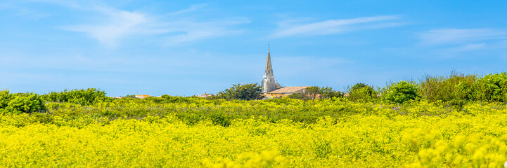 Wall Mural - Panoramic landscape of Ile de Ré with Notre-Dame-de-l'Assomption church in Sainte-Marie-de-Ré, France 