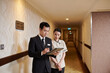 © DragonImages - Manager and hotel maid checking list of guests on tablet computer before cleaning rooms