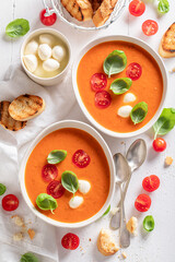 Wall Mural - Creamy tomato soup made of basil and cherry tomatoes.