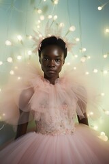 Wall Mural - A young girl in a vibrant pink dress, adorned with delicate ruffles, stands confidently against a wall, her beauty and poise radiating joy and freedom