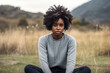 © Anastasiia - Sadness African Woman In Black Jeans On Nature Landscape Background