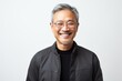 © Anne-Marie Albrecht - Portrait of happy asian senior man in black jacket and glasses