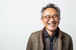 © Anne-Marie Albrecht - Portrait of a happy senior asian man laughing on white background
