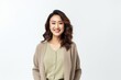 © Anne-Marie Albrecht - Portrait of a smiling young asian businesswoman standing over white background