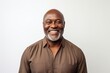 © Anne-Marie Albrecht - Portrait of a happy mature african american man smiling against white background