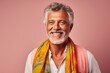 Group portrait of a Brazilian man in his 60s in a pastel or soft colors background wearing a foulard